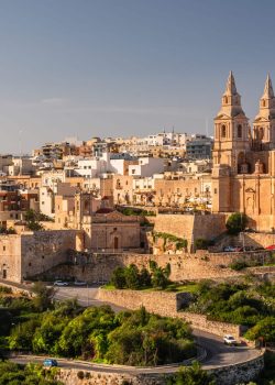 Il-Mellieha, Malta -  Mellieha town at sunny day with Paris Church on hill top.