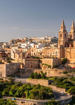 Il-Mellieha, Malta -  Mellieha town at sunny day with Paris Church on hill top.