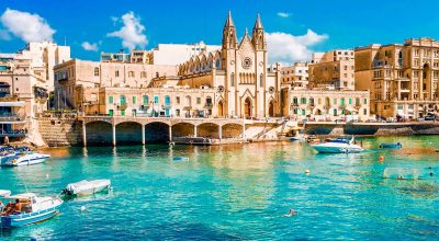 Swimming, boating, and enjoying Balluta Bay