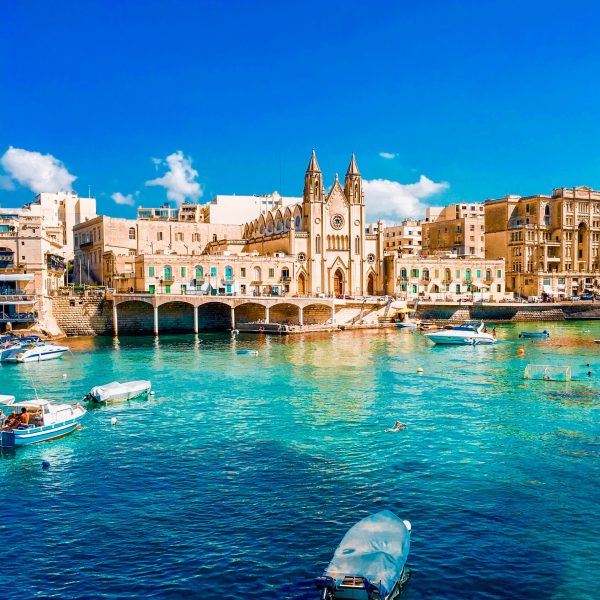 Swimming, boating, and enjoying Balluta Bay